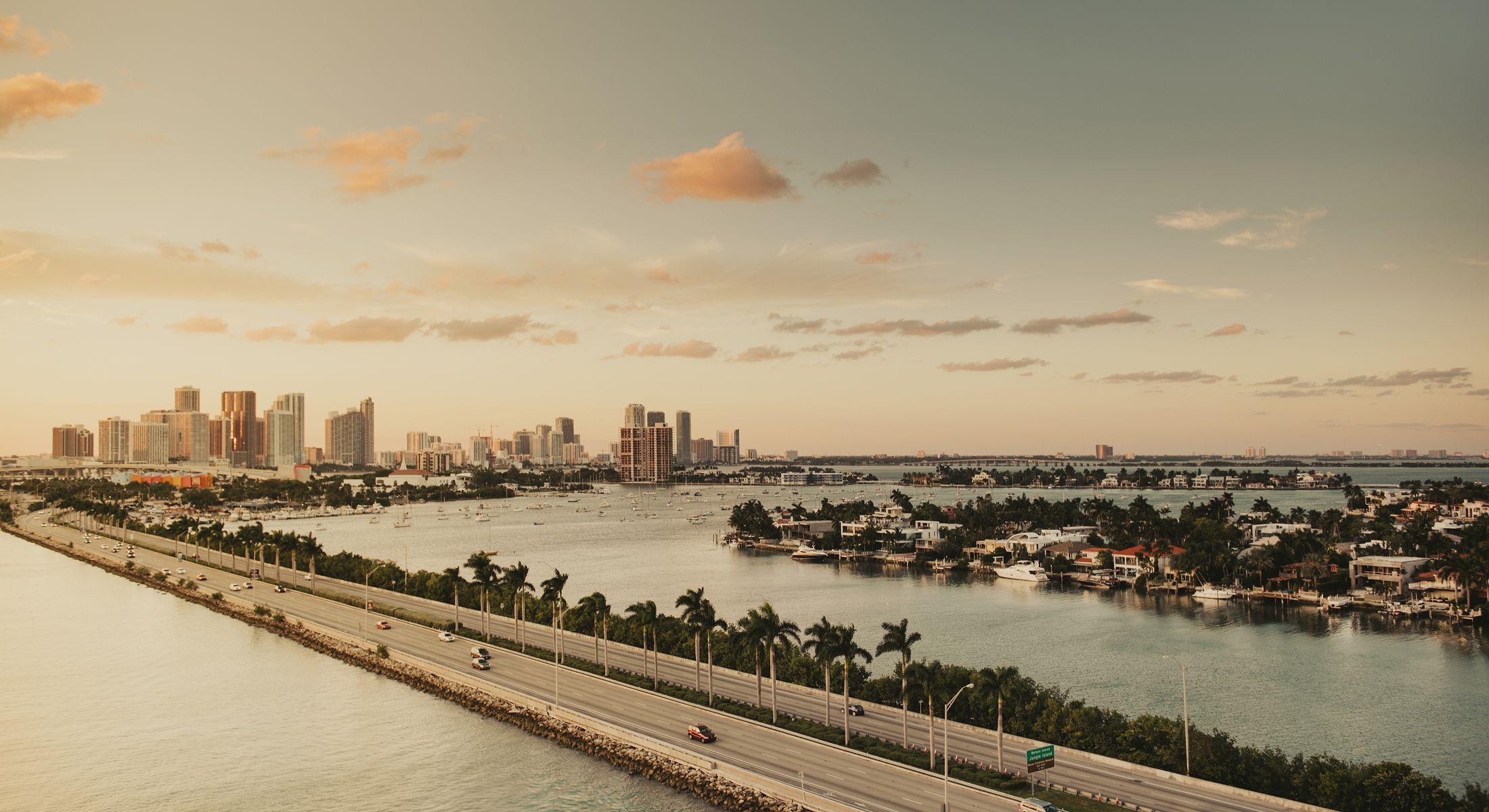 City skyline over water during sunset.