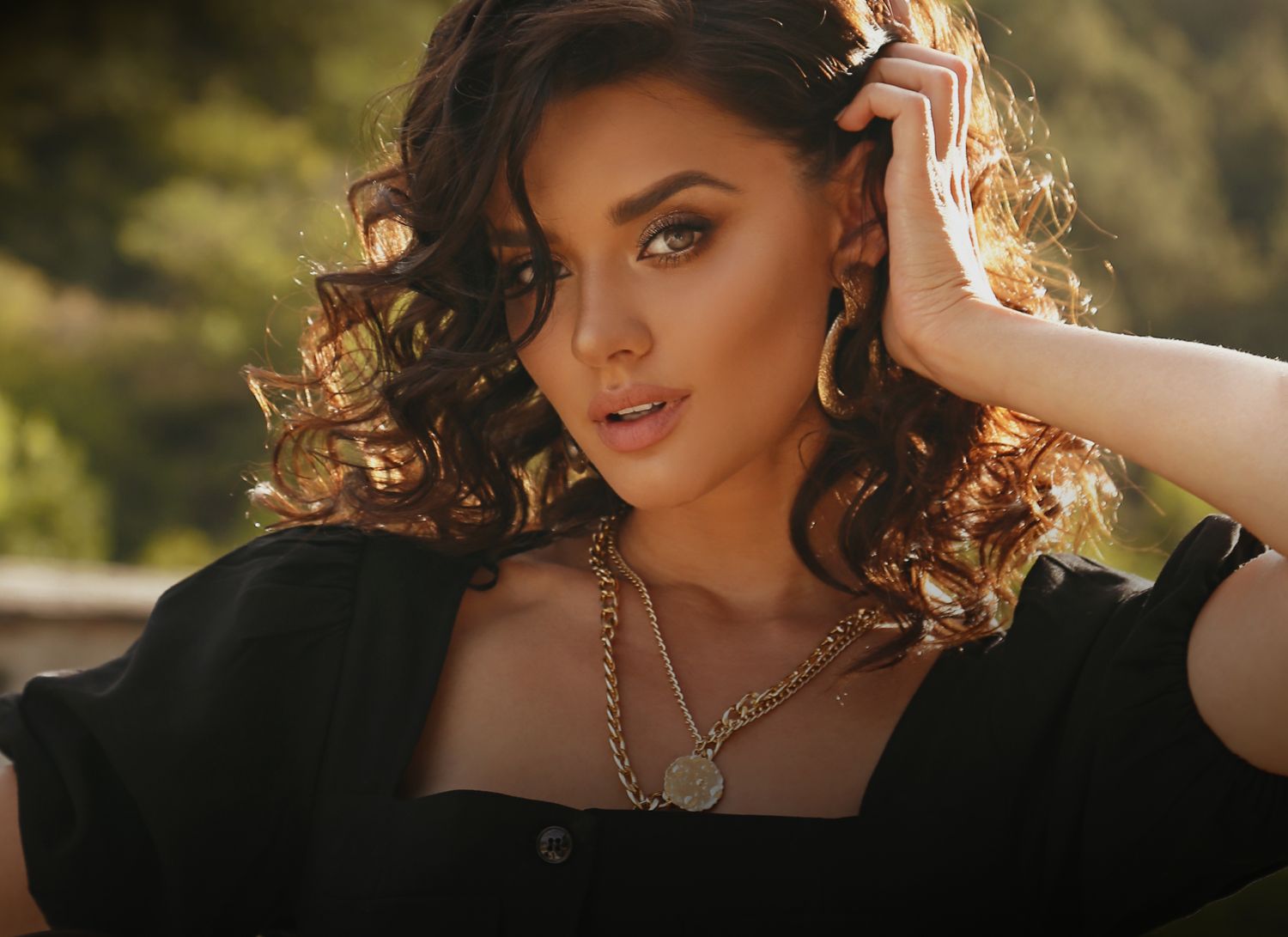 Close-up of a woman with wavy hair.